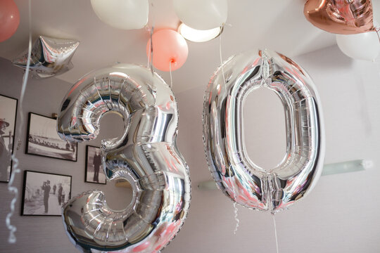 Room decorated with colorful balloons for party