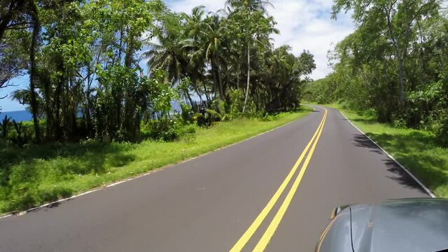 POV Driving at the Scenic Kalapana-Kapoho road along the coastline. Big Island, Hawaii, USA
