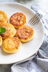 cottage cheese pancake cheesecake curd breakfast dessert sweet syrniki healthy meal top view copy space rustic food background rustic. top view