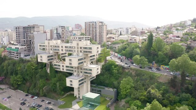 Tbilisi, Georgia. Building of Bank of Georgia headquarters ex for the Ministry of Highway. Beautiful Soviet constructivists, Brutalist and Structuralism. Aerial drone photo from above