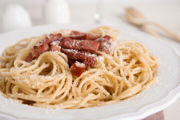Delicious Carbonara pasta in plate on table, closeup