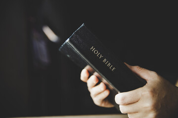 Woman holding the bible in hands