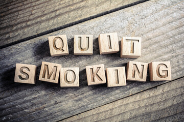 Quit Smoking Written On Wooden Blocks On A Board - Reminder Concept