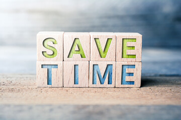 Save Time Written On Wooden Blocks On A Board