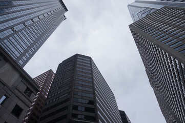 Fototapeta na wymiar Circle of Glass Steel and Stone Towers Against Overcast Sky in Philadelphia