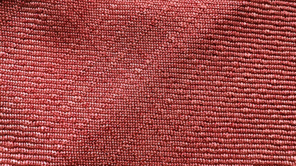 red textile fabric texture use for background. close-up or macro view of textile red fabric showing...