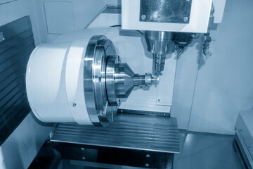 The  5-axis machining center cutting the turbocharger blade with solid ball end mill tool. The automotive part manufacturing process by multi-axis machining center.