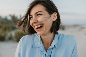 smiling portrait of candid laughing woman - Powered by Adobe