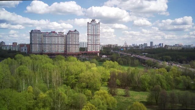 Amazing high angle top drone view on Strogino and Shchukino	district which are situated in beautiful green river park.
