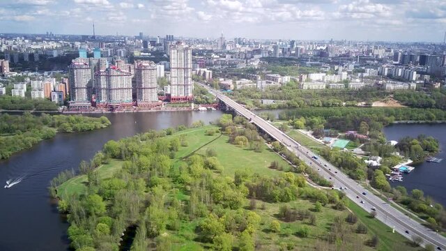 Amazing high angle top drone view on Strogino and Shchukino	district which are situated in beautiful green river park.
