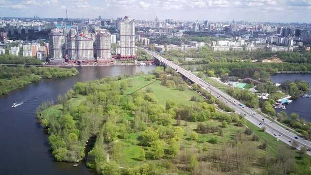 Amazing high angle top drone view on Strogino and Shchukino	district which are situated in beautiful green river park.
