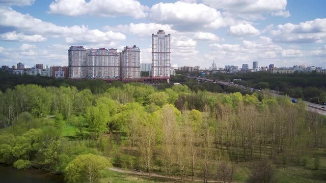 Amazing high angle top drone view on Strogino and Shchukino	district which are situated in beautiful green river park.
