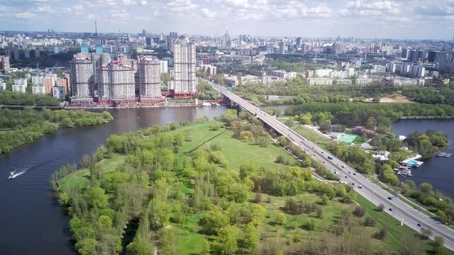 Amazing high angle top drone view on Strogino and Shchukino	district which are situated in beautiful green river park.
