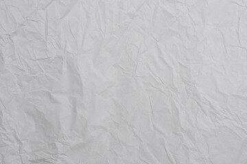 Crumpled white paper background.