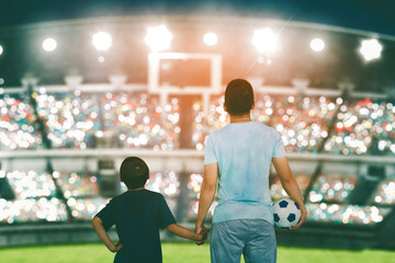 Child and father standing on the spectator seat