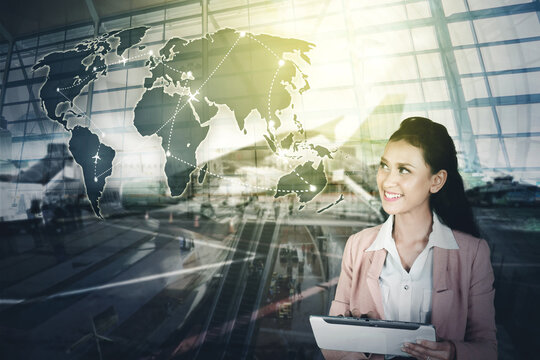 Businesswoman using tablet to checks flight routes