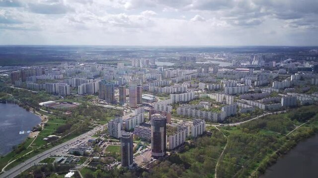 Amazing high angle top drone view on Strogino and Shchukino	district which are situated in beautiful green river park.
