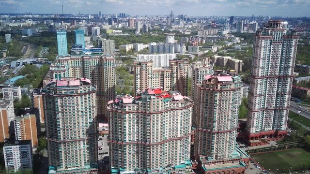 Amazing high angle top drone view on Strogino and Shchukino	district which are situated in beautiful green river park.
