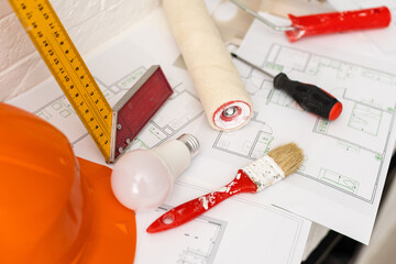 Decorator table with painting project and tools. Elevated view. Horizontal composition.