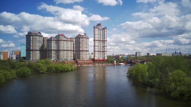 Amazing high angle top drone view on Strogino and Shchukino	district which are situated in beautiful green river park.
