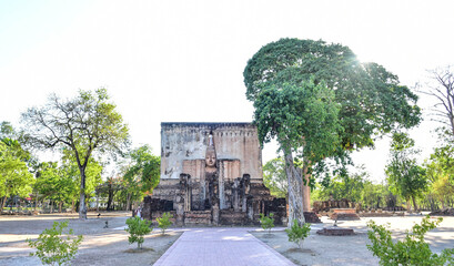 Fototapeta na wymiar An ancient temple with a large Mara Buddha image at Wat Si Chum, known as `Phra Achana` is one of the ancient religious sites in the area of ​​Sukhothai Historical Park, Thailand.