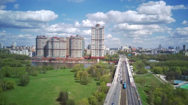 Amazing high angle top drone view on Strogino and Shchukino	district which are situated in beautiful green river park.
