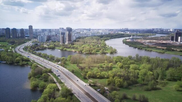 Amazing high angle top drone view on Strogino and Shchukino	district which are situated in beautiful green river park.
