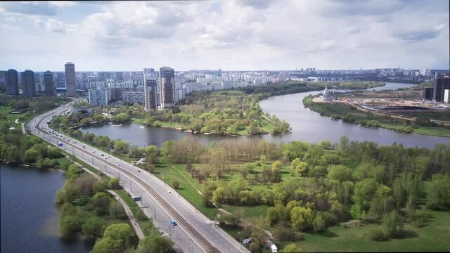 Amazing high angle top drone view on Strogino and Shchukino	district which are situated in beautiful green river park.

