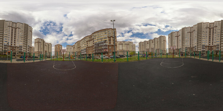 Spherical panorama 360 degrees public basketball court in residential area of city. Full equirectangular projection for virtual reality or VR.