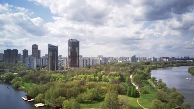 Amazing high angle top drone view on Strogino and Shchukino	district which are situated in beautiful green river park.

