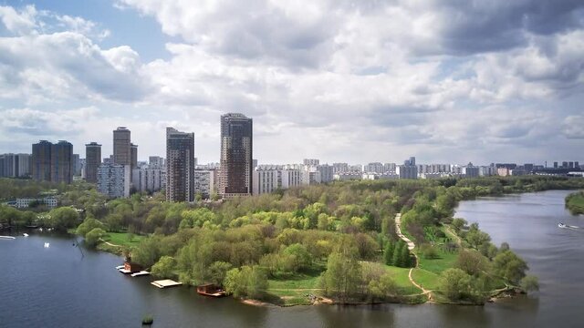 Amazing high angle top drone view on Strogino and Shchukino	district which are situated in beautiful green river park.
