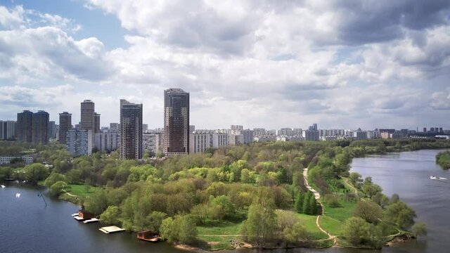 Amazing high angle top drone view on Strogino and Shchukino	district which are situated in beautiful green river park.
