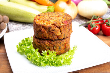 Round vegetarian patties or burgers made from grains, vegetables and legumes