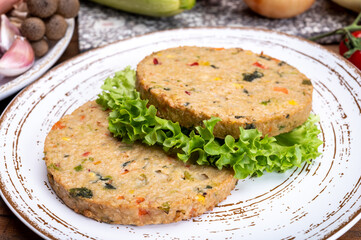 Round vegetarian patties or burgers made from grains, vegetables and legumes
