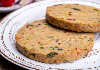 Round vegetarian patties or burgers made from grains, vegetables and legumes