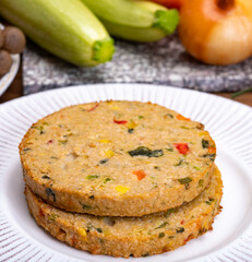 Round vegetarian patties or burgers made from grains, vegetables and legumes