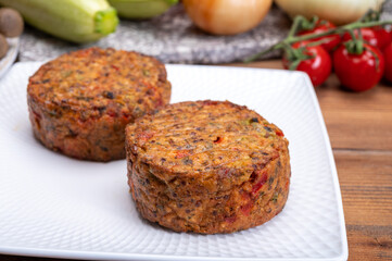 Round vegetarian patties or burgers made from grains, vegetables and legumes