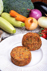 Round vegetarian patties or burgers made from grains, vegetables and legumes