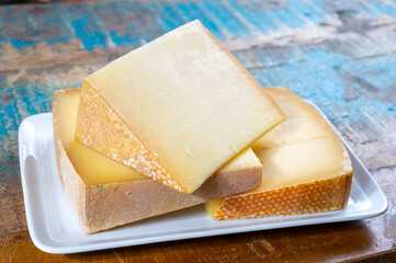 Cheese collection, French comte and Swiss gruyere cheeses