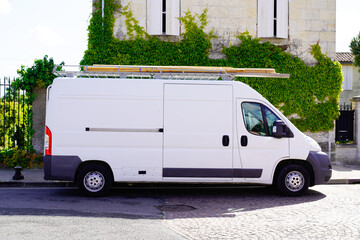craftsman panel van and ladder on the roof  with blank advertisement space © OceanProd