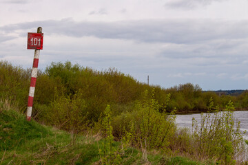 milepost by the river