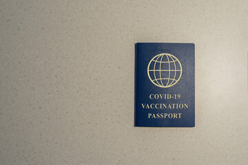 Vaccination passport for covid-19 on the gray background. risk free certificate document concept, health record proof of patient recovery.