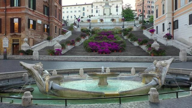 Piazza di Spagna in Rome, The Spanish Steps with flowers. Trinit&agrave; dei Monti. Spectacular aerial drone shot of flower covered stairway on a spring day.