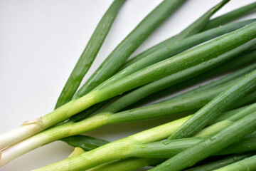 Fototapeta premium Green onion on green close-up on white background