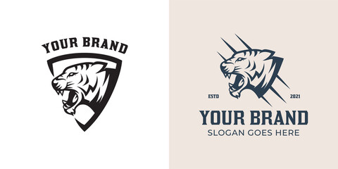 vintage retro logo of shield with tiger head, jaguar, panther black version logo collection for your brand © Agung