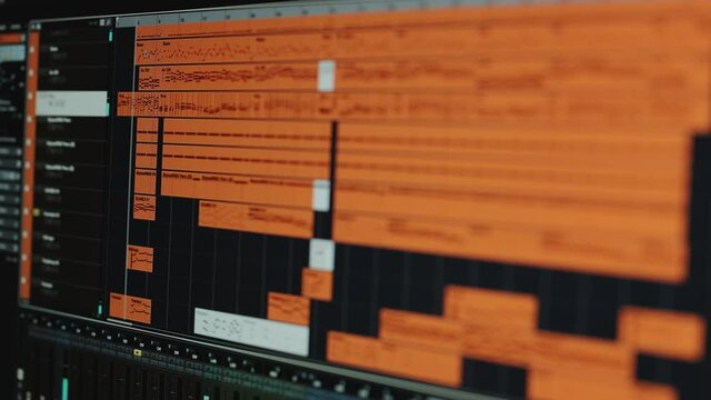Professional Sound and Music Recording. Modern Music Recording Studio Equipment: Computer Screen Showing User Interface of DAW Digital Audio Workstation Software with Track Song Playing