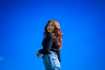 red haired model posing, portrait of a woman, pretty woman in jeans