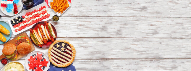 Fourth of July, patriotic, American themed food. Top view side border on a white wood banner...