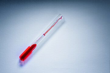 Medical laboratory. A test tube with blood on a white background. The concept of laboratory research.