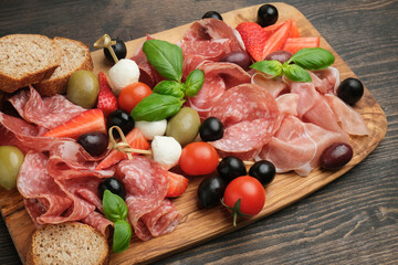 Italy food Charcuterie board salami prosciutto mozzarella olives